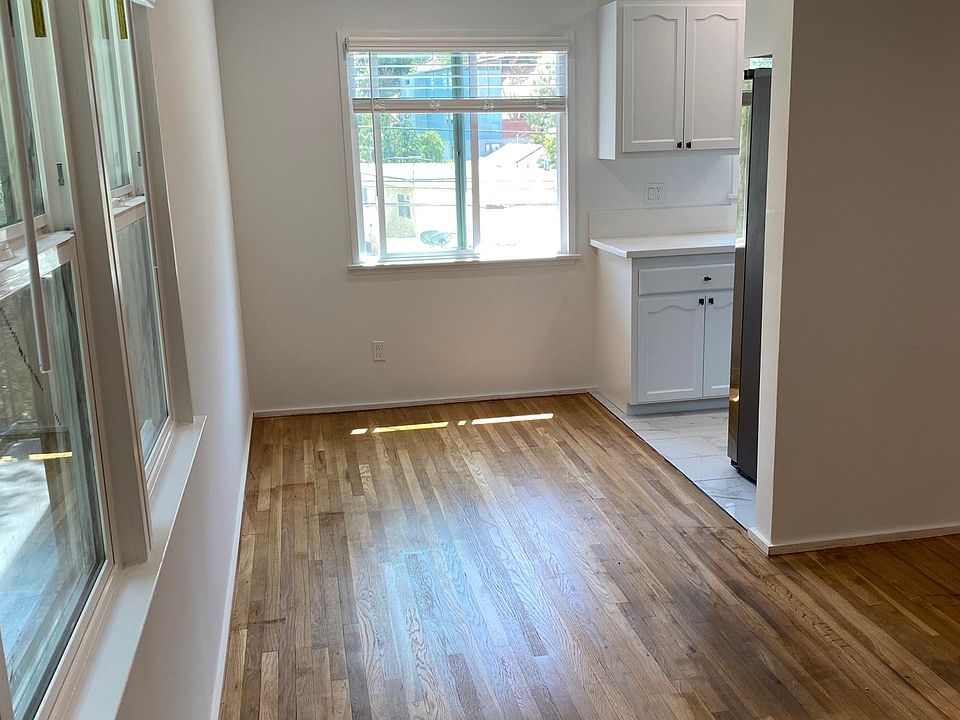 entry to the left is a dining area for 4 and the kitchen.