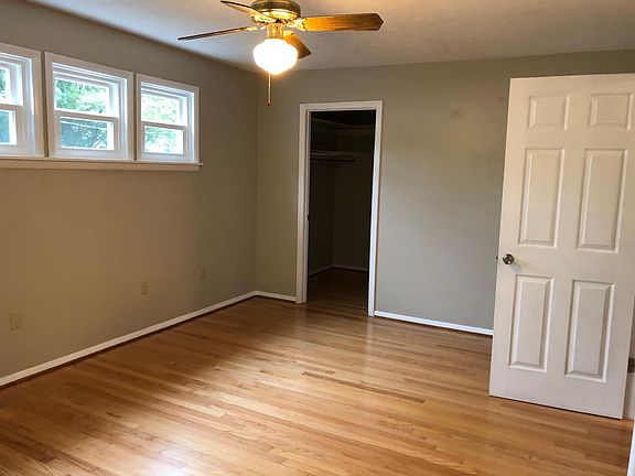 Master bedroom with new windows and doors and walk-in closet.