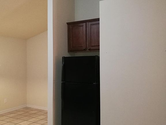 this photo is from similar home. a new similar refrigerator will be provided in the kitchen