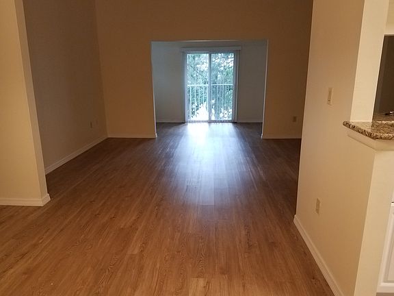 Dining, Living and Florida Rm with hardwood floors and cathedral ceiling