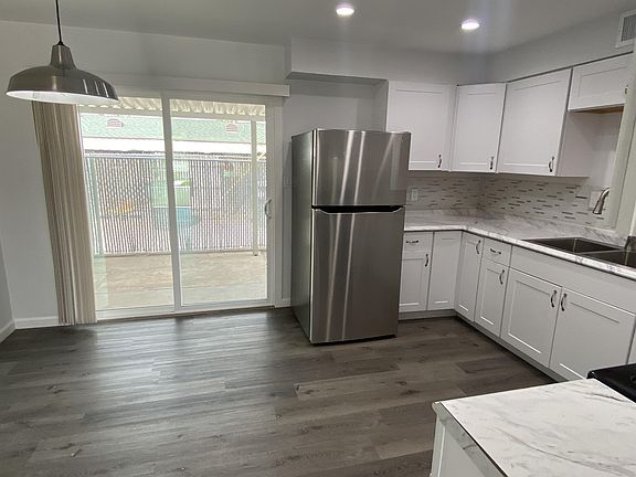 Sliding Glass Door Leading to Private Backyard