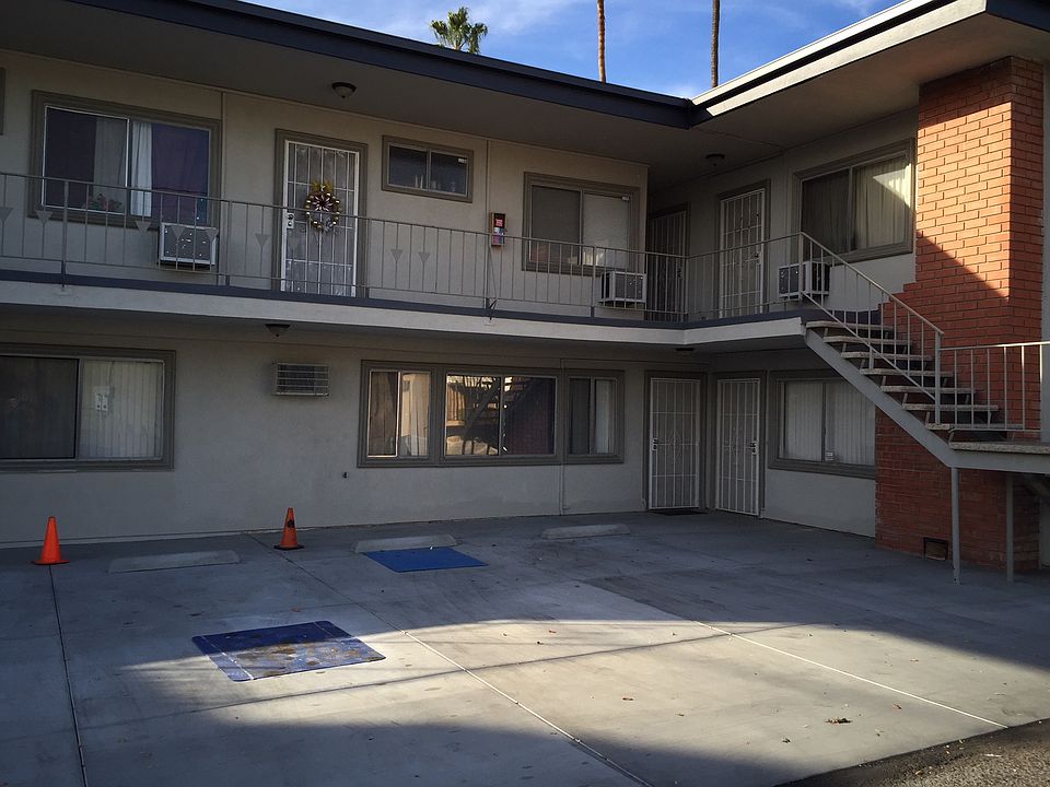Parking area facing east showing apartments 1 and 2 below and 3, 4 and 5 upstairs