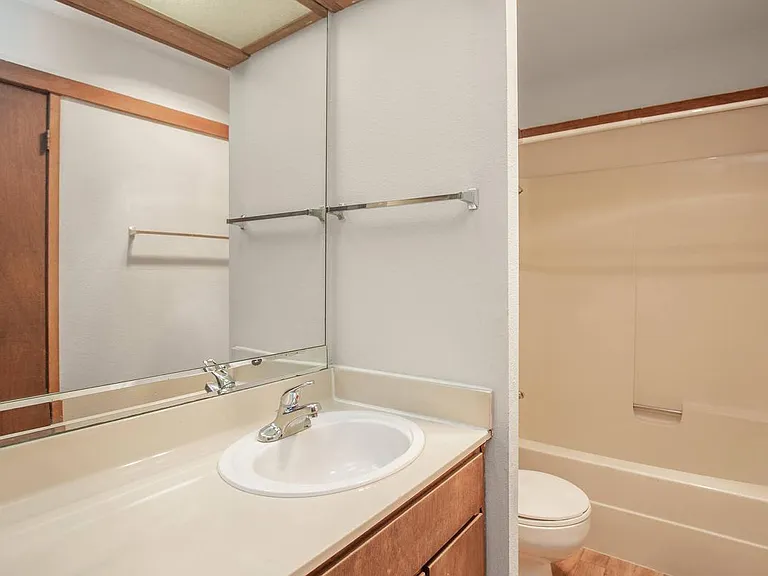 Bright and Practical Bathroom at Mariposa Apartments