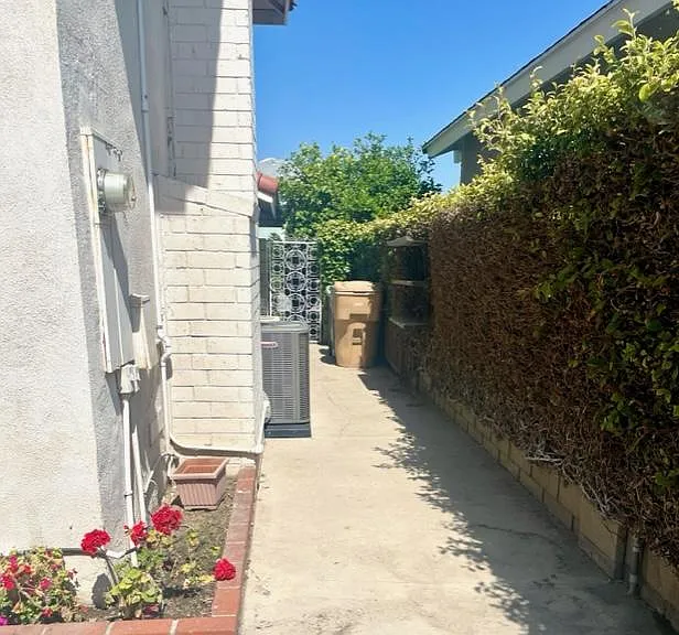 Large side yard with door into garage.