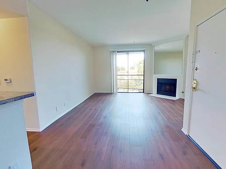 Living area with fireplace in apartment #319