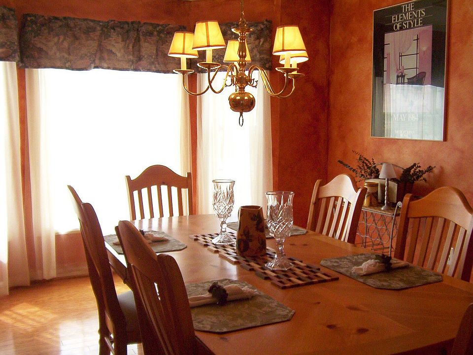 formal dining room with hardwood floors and bay window
