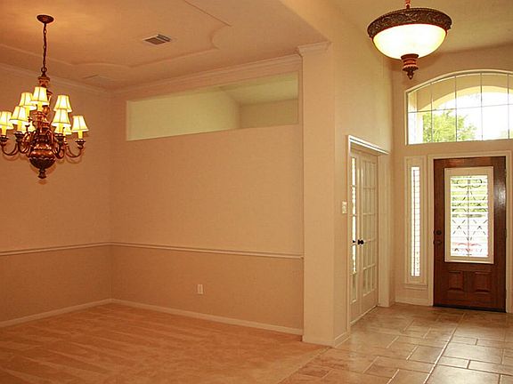 View of front entry and Formal Dining Room.