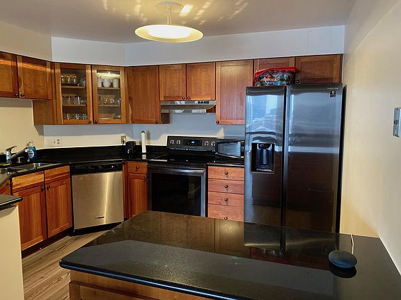 Stainless steel appliances, granite counter top, including cookware and silverware