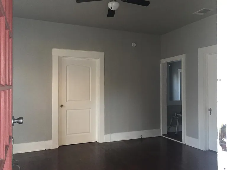 Freshly painted living room with new ceiling fan