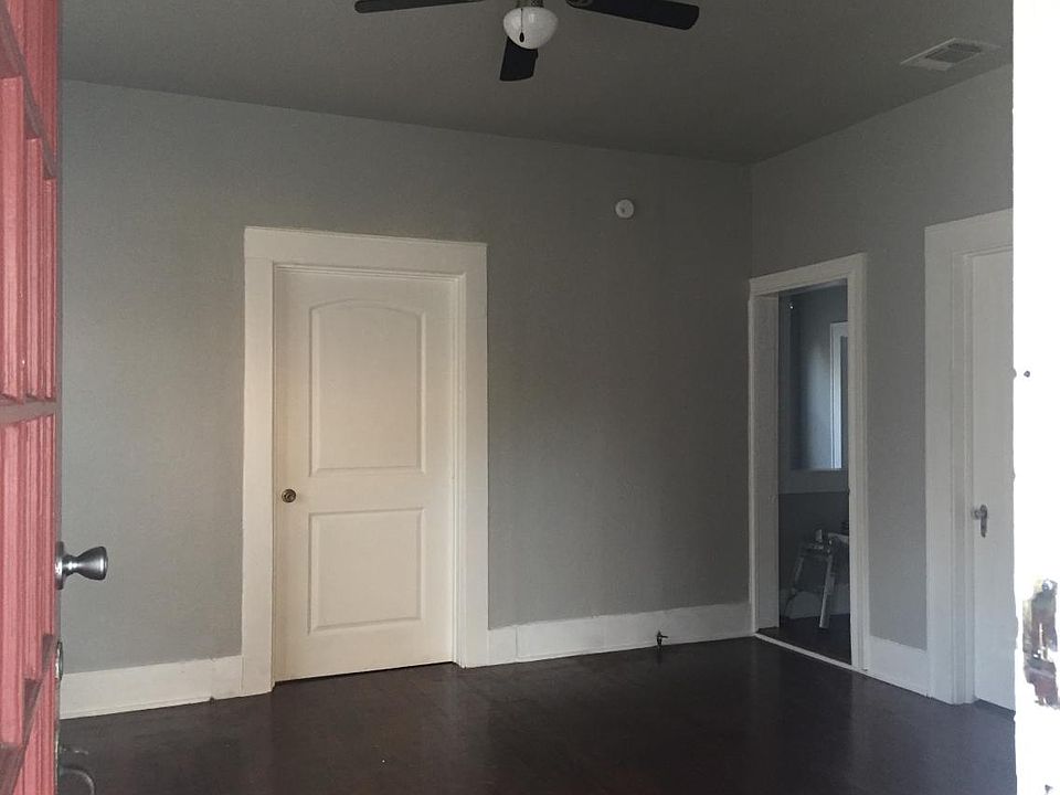 Freshly painted living room with new ceiling fan