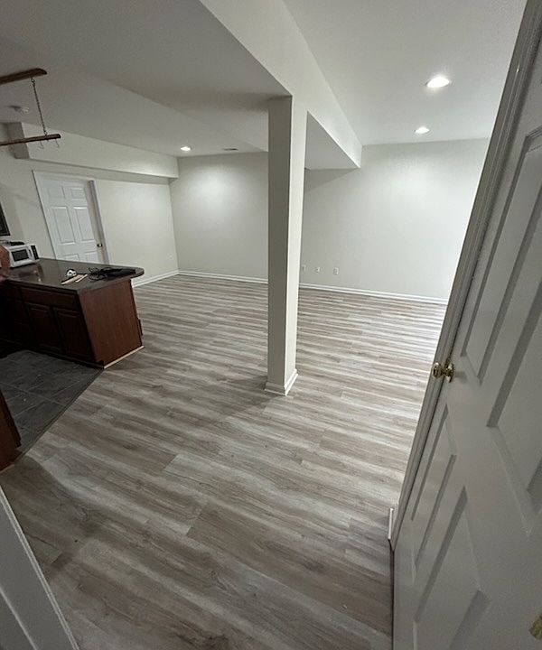 Looking into living space from bedroom, all floors except bathroom and utility room are now matching lvp as shown on this pic.