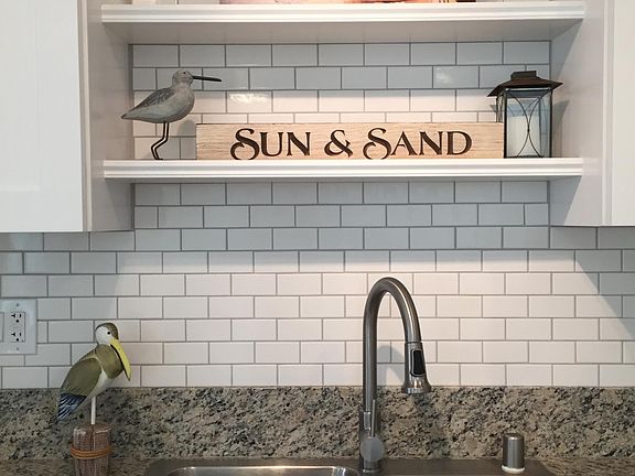 Many decorative adds to this remodeled kitchen with granite and newer appliances