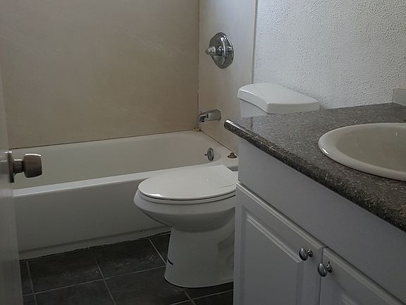 bathroom with granite countertop