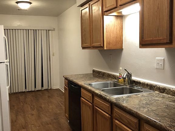 Newly installed kitchen cabinet, sink, appliances.