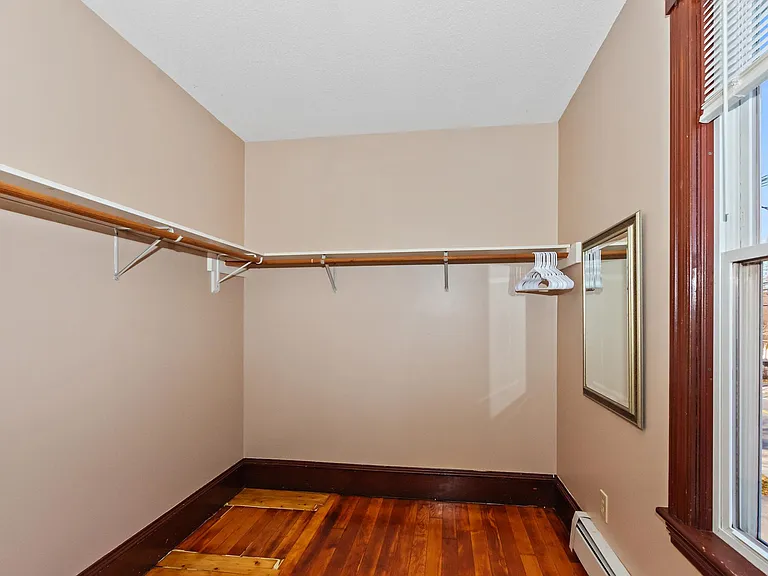 Walk-in closet for 2nd floor bedroom at front of house