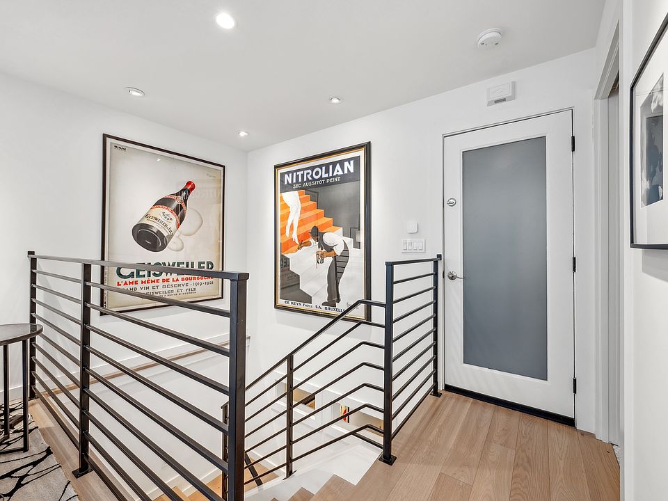 Front door with view of stairs to bedroom level