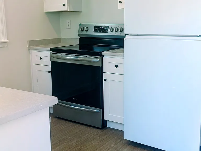 Galley kitchen right as you walk in from the back patio.