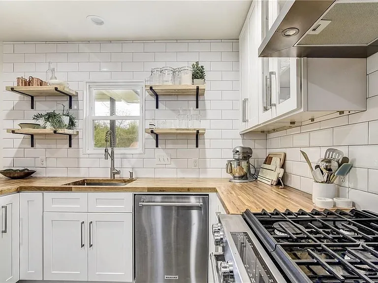 Updated Kitchen with New Appliances, Butcher Block Counter tops, Great Storage, Floating Shelves, Gas Range