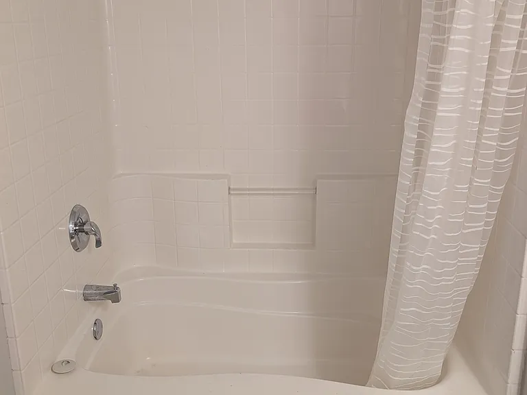 Full tub and shower combination with rainfall showerhead