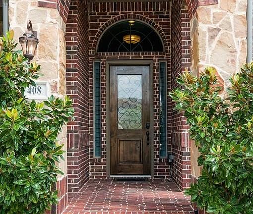 Grand entry way with large covered front porch
