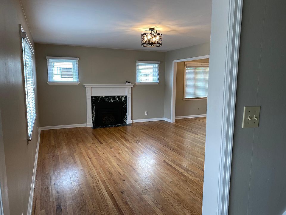 Taken from just inside the front door. The stairway to the bedrooms and upstairs bath is to the right.