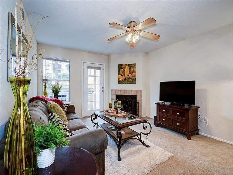 Plush carpeting in living areas and wood-burning fireplace
