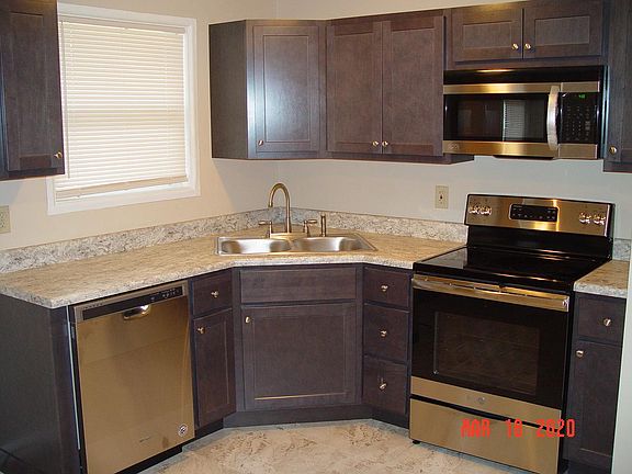 Brand-new eat in kitchen with new stainless steel appliances