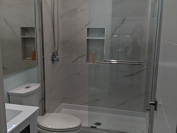 Brand new high end tiles in shower and floor