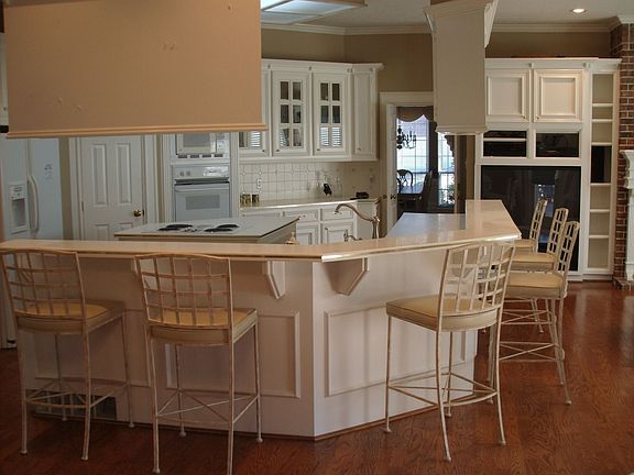 Room opens to formal living and dining room