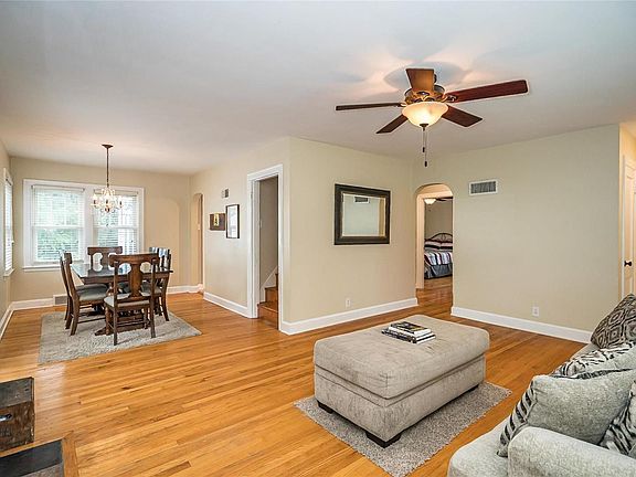 The Living Room opens to the Dinning Room and the stairs to the upper level.