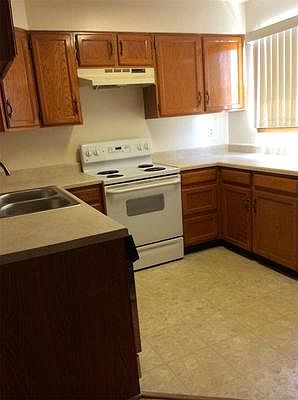 Open Kitchen with New Stove, Dishwasher and Refrigerator.