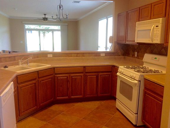 Kitchen with gas range and upgraded cabinetry and pantry