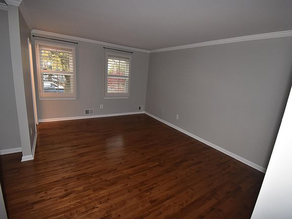 Distinctive wooden shutters throughout main level