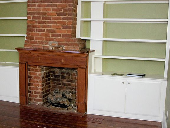 Living room with gas fireplace & built-in cabinetry