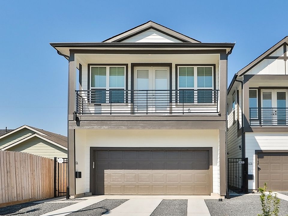 Enjoy sleek geometric lines and a spacious garage in this modern Independence Heights home in Housto