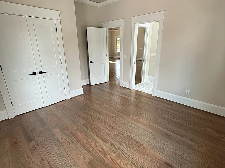 Second Bedroom showing doors to main room and the bath