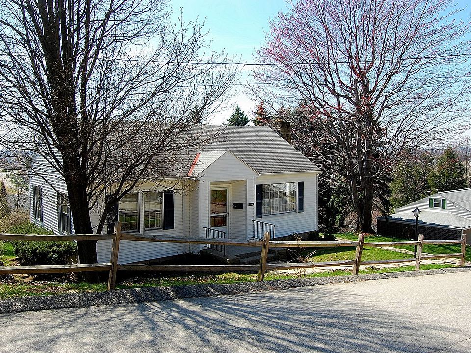 Tree shaded front yard with post & rail fence