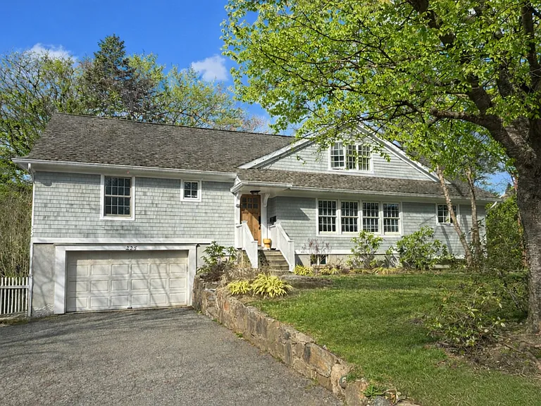 Hamptons shingle style home situated on a level double lot