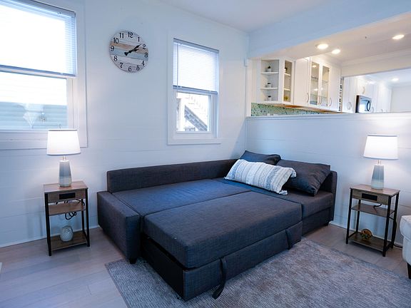 Couch opens to full size bed to sleep 2. All bedding conveniently stored at one end