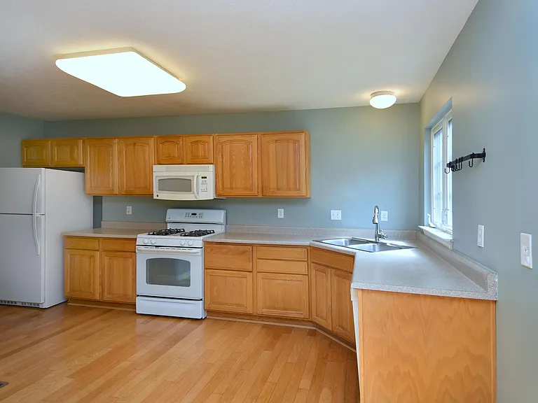 Kitchen is spacious and has lots of storage space.