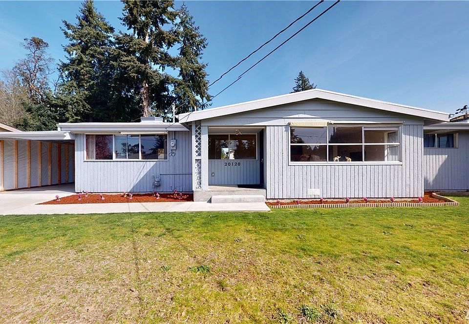 Newer roof, carport and level front yard