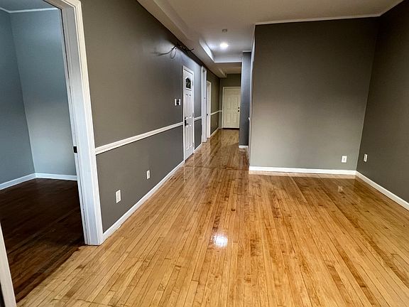 Living room view of hallway leading to kitchen.