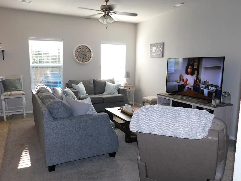 Newer wood look LVP throughout the downstairs (no longer has the carpeting shown in the photo)