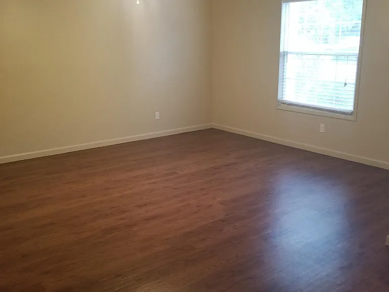 Large open living room with ceiling fan