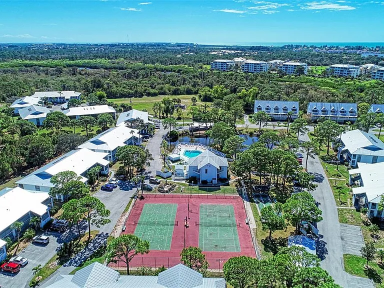 Game, set, match! __ Whether you're a tennis pro or a pickleball enthusiast, our courts are ready for you. With this birds-eye view, you can see the perfect setup we have for some friendly competition under the Florida sun.