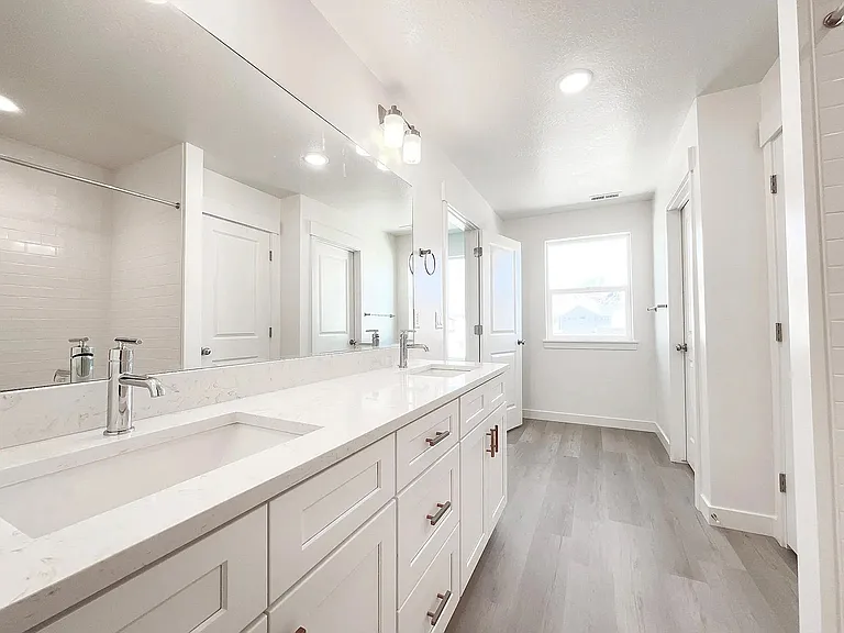 Primary Bath _ double quartz vanity, glass shower (not pictured)