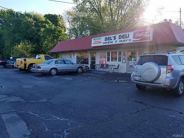 Del's Deli a multi-functional store where current customers are greeted and a purchase, food-to-go, lottery tickets, or wiring m