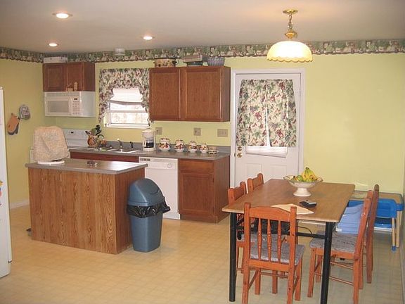 Large eat-in kitchen with walk out to deck and large back yard.