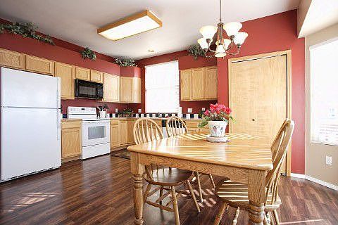 Sunny kitchen boasts a large dining area