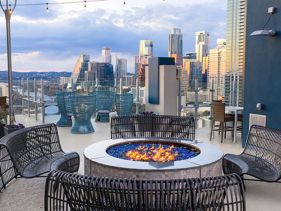 Rooftop lounge with large fire pit and Downtown Austin views